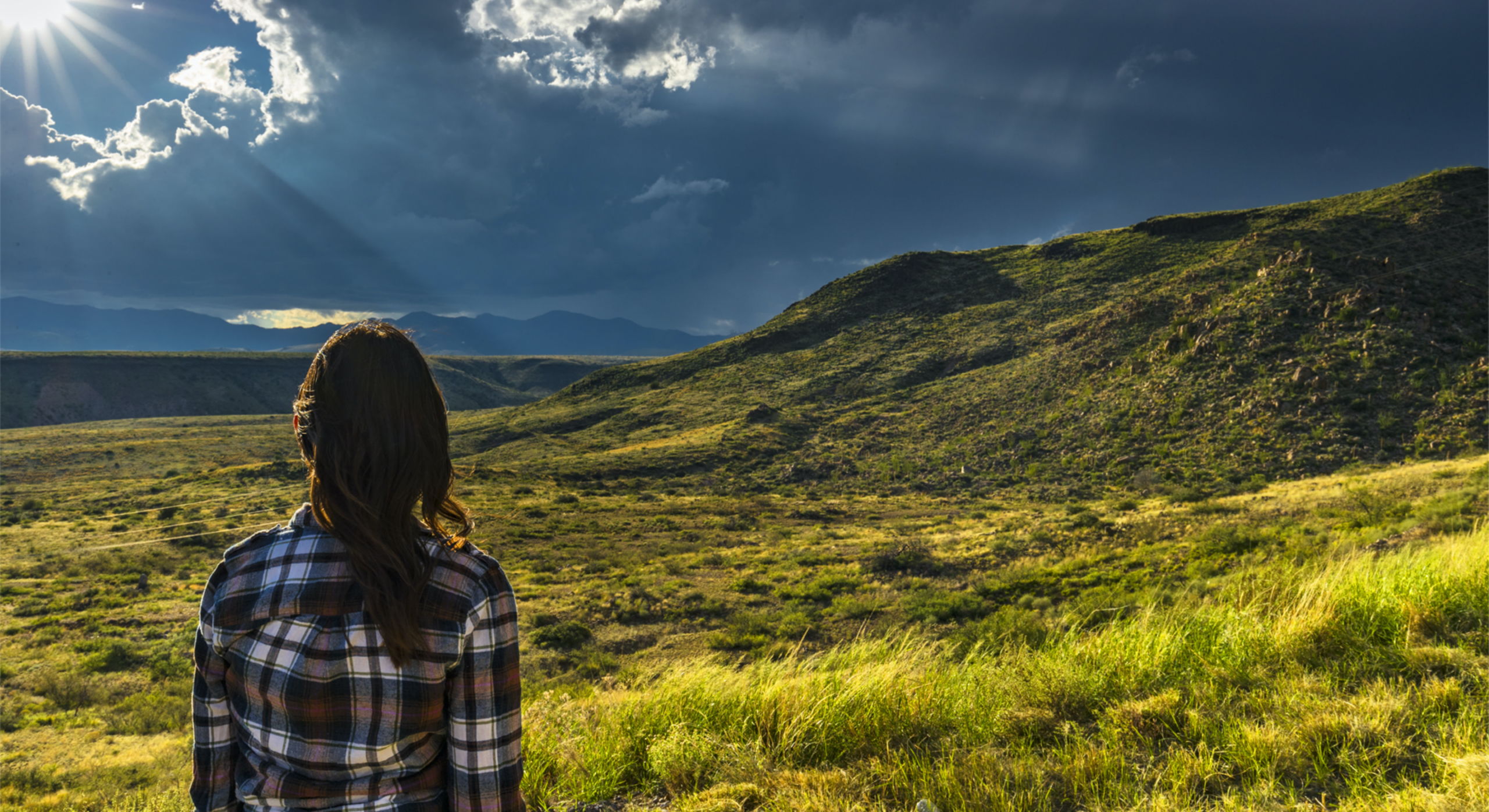 Woman in grassy plains of New Mexico