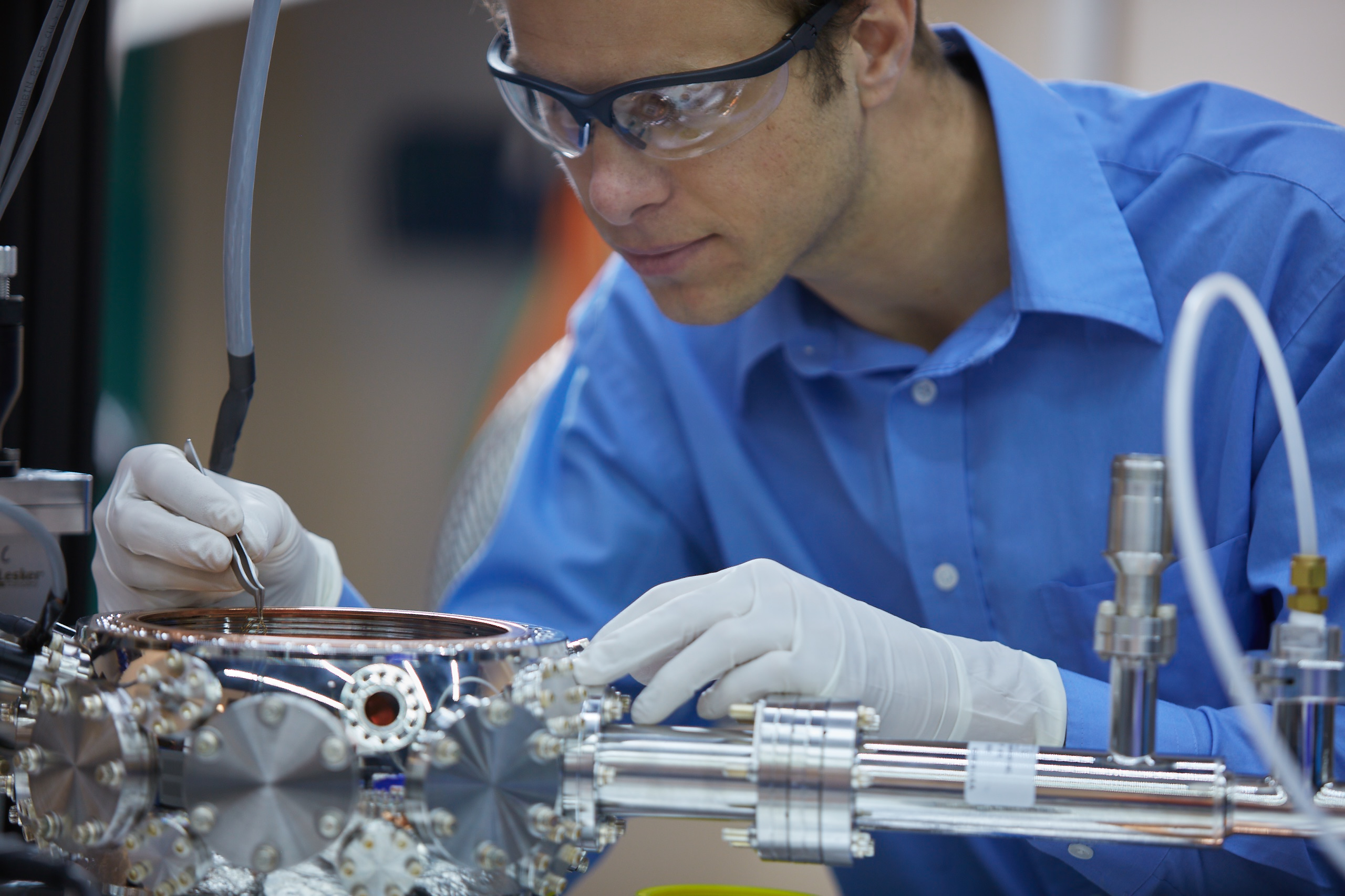 Quantum Grant Scientist working on a mechanical part