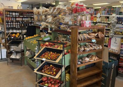 Inside small market displaying grocery items.